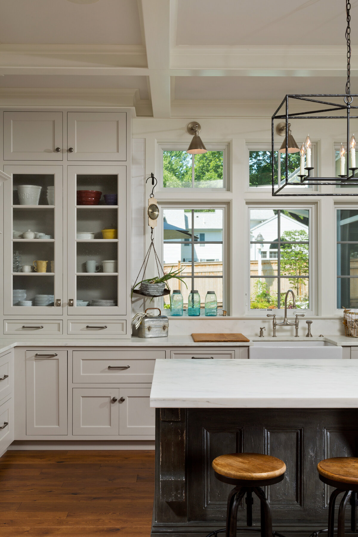 white kitchen with window overlooking yard