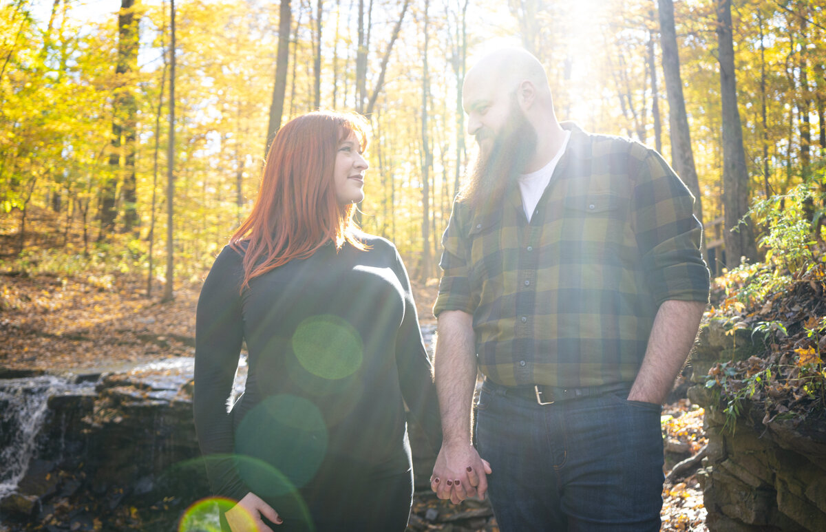 Bright photo of soon-to-be parents smiling at each other