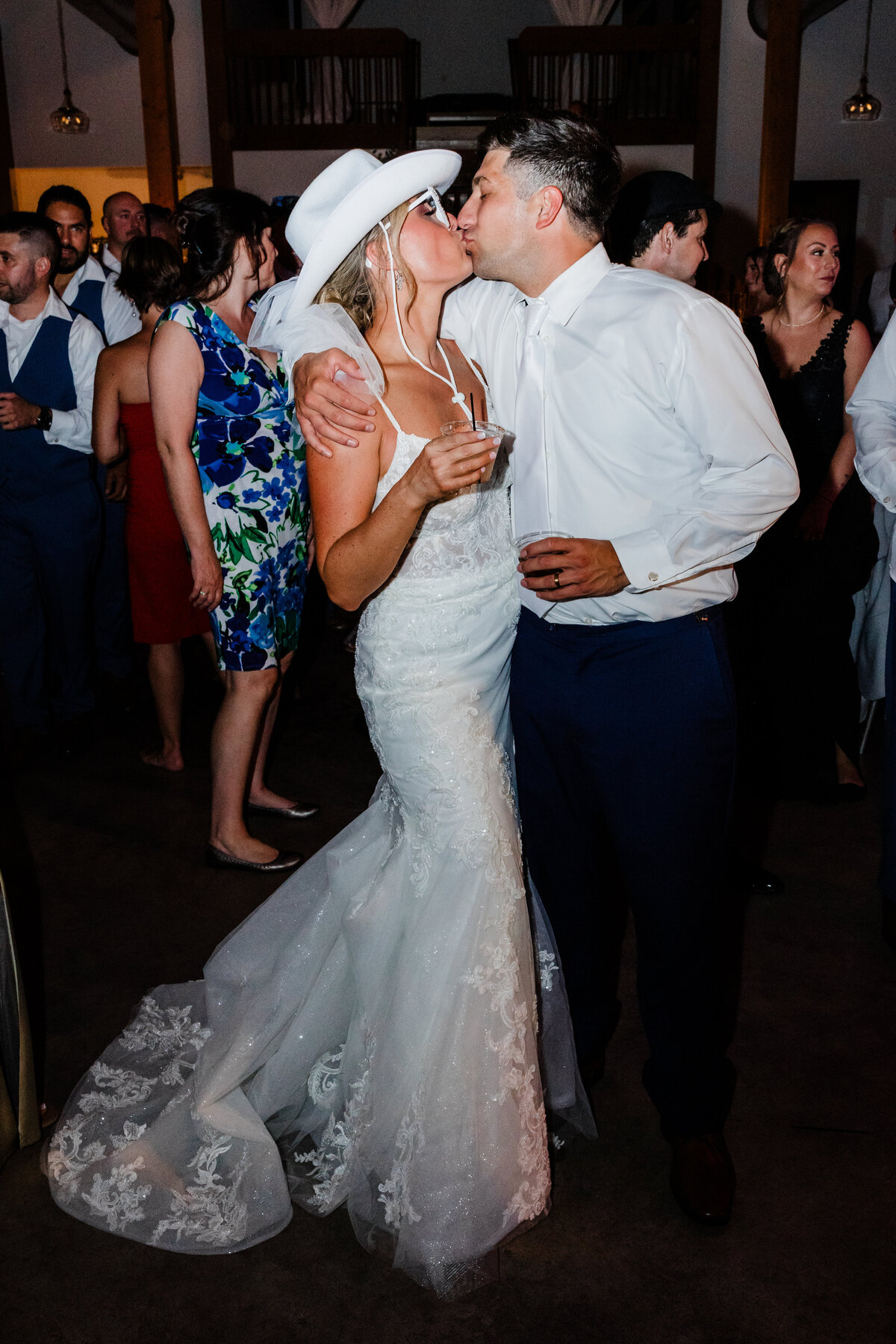 Couple enjoying their first dance surrounded by guests during a wedding reception in South Bend.