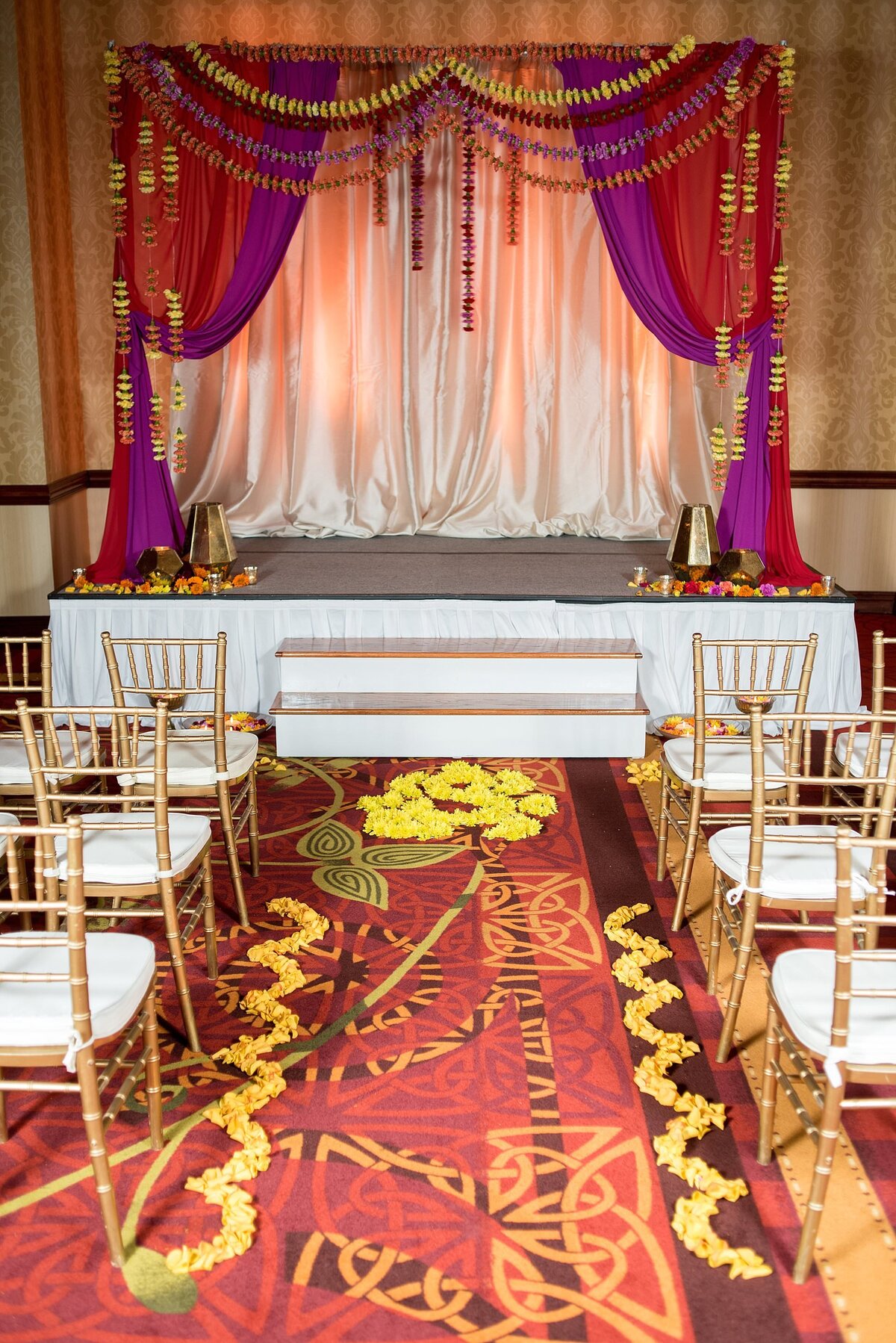Red, Purple and gold mandap for Hindu wedding ceremony