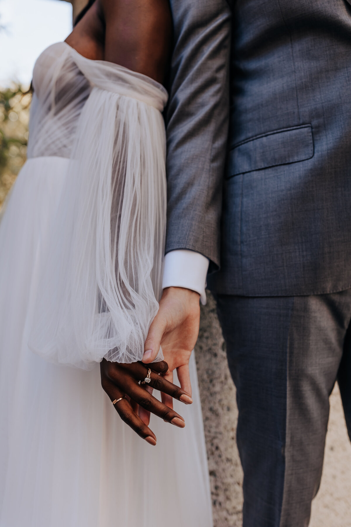 Destination elopement photographer captures couple holding hands