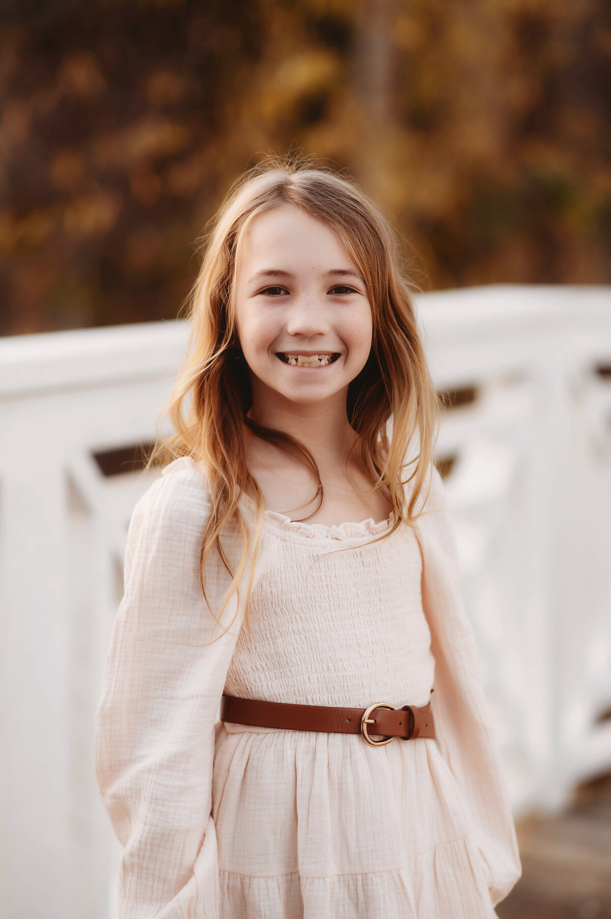 Little girl smiles at the camera during her Family Portraits at Cypress Gardens near Charleston, South Carolina.