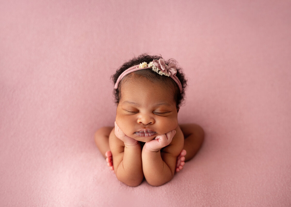 melanin newborn girl in frog pose