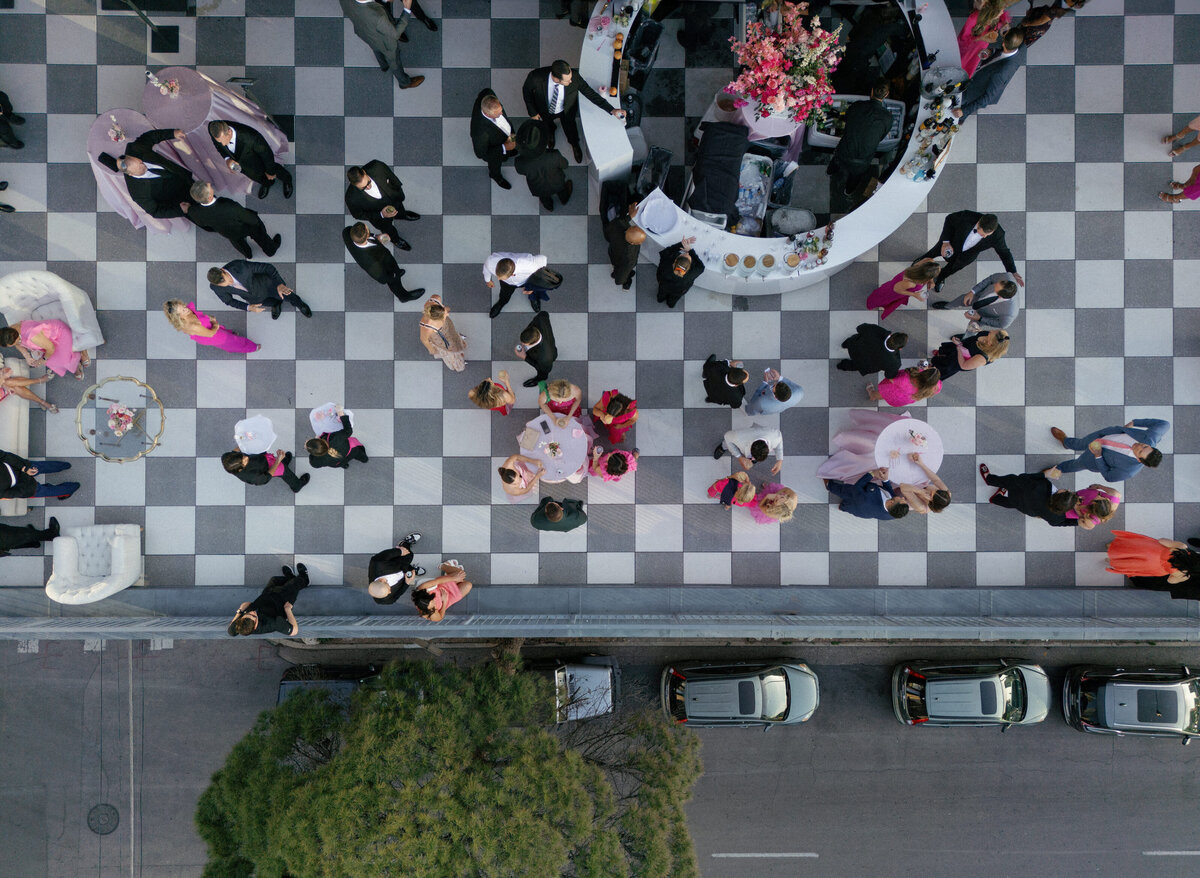 checkered floor of party on large rooftop patio  from above