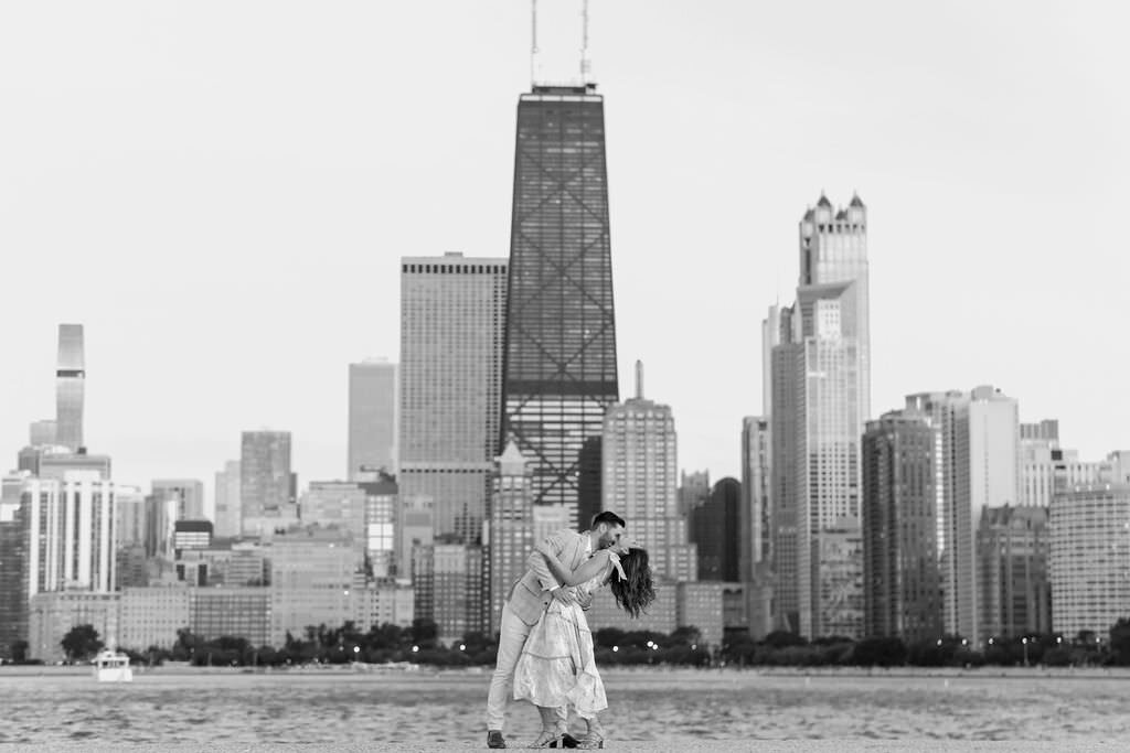 An engagement photography session at The Wrigley Building and North Ave Beach in Chicago, Illinois - 43