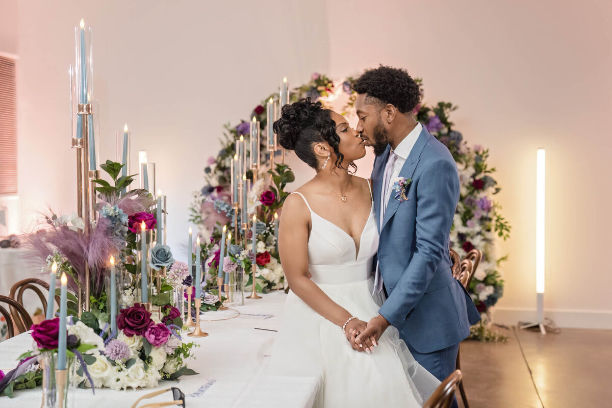 Newlyweds sharing a romantic kiss at their beautifully planned wedding ceremony in Raleigh, NC.
