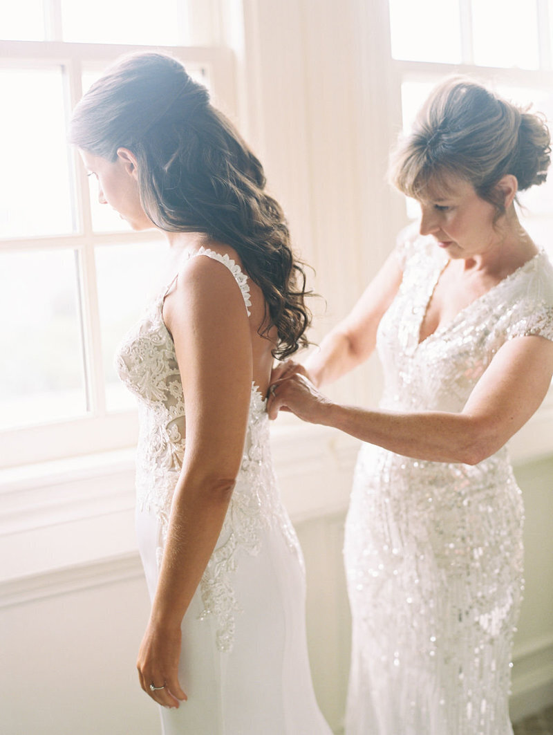 bride-getting-in-gown