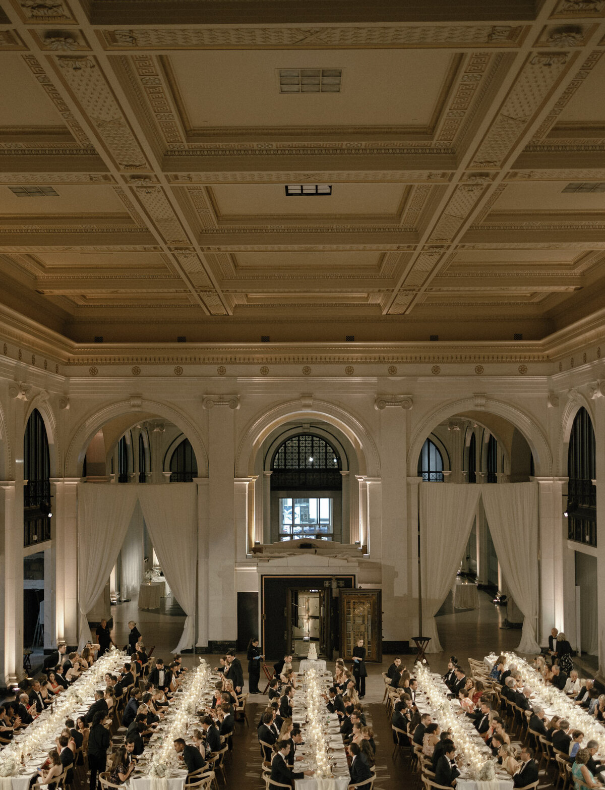 stunning architectural detail with guests dining at a candlelit wedding reception, State Savings Bank, Detroit