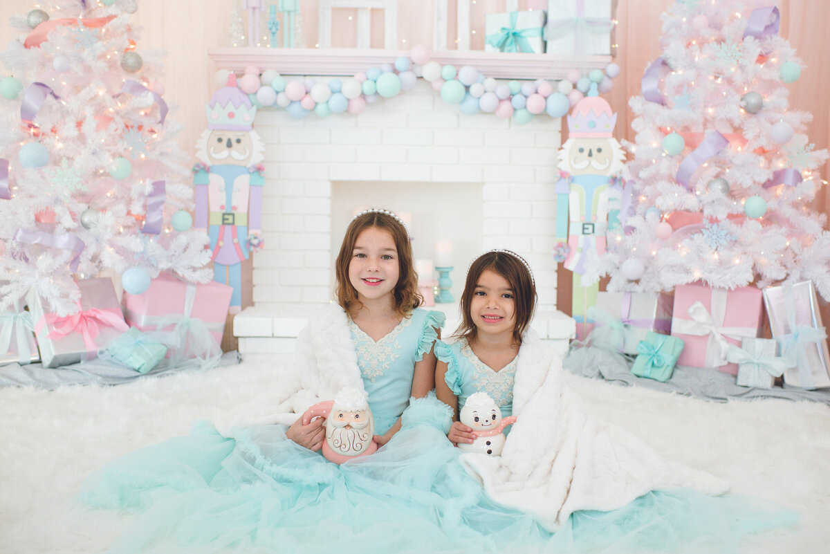 pastel winter christmas themed photos with two girls