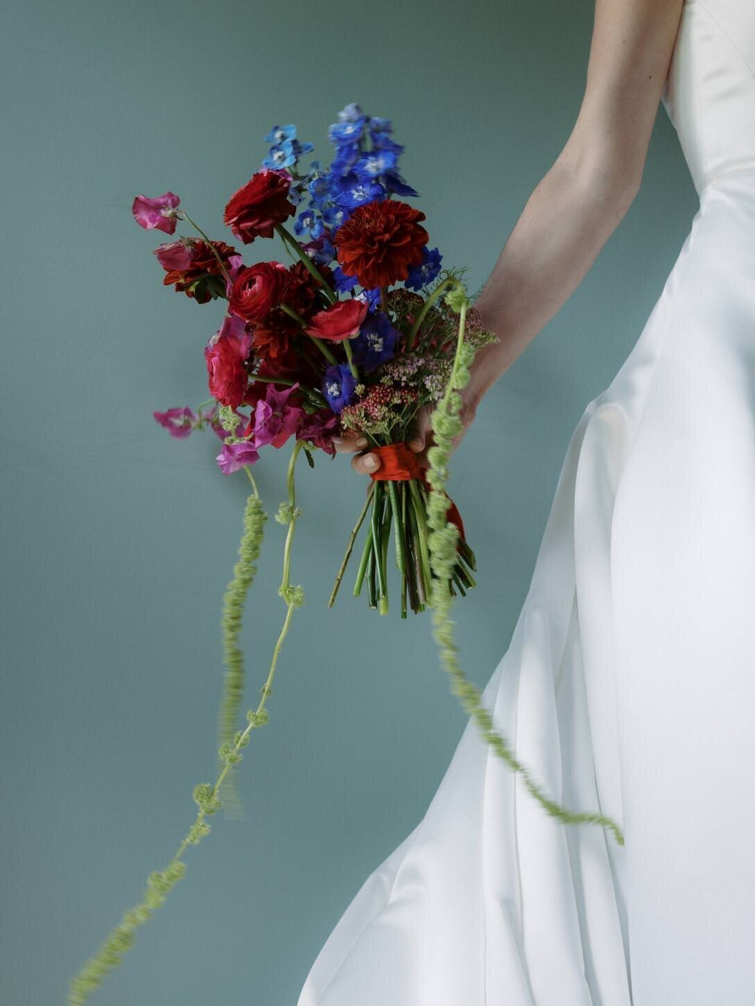 troutbeck-02-close-up-of-bride-holding-unique-floral-bouquet-at-troutbeck-jenny-fu-studio