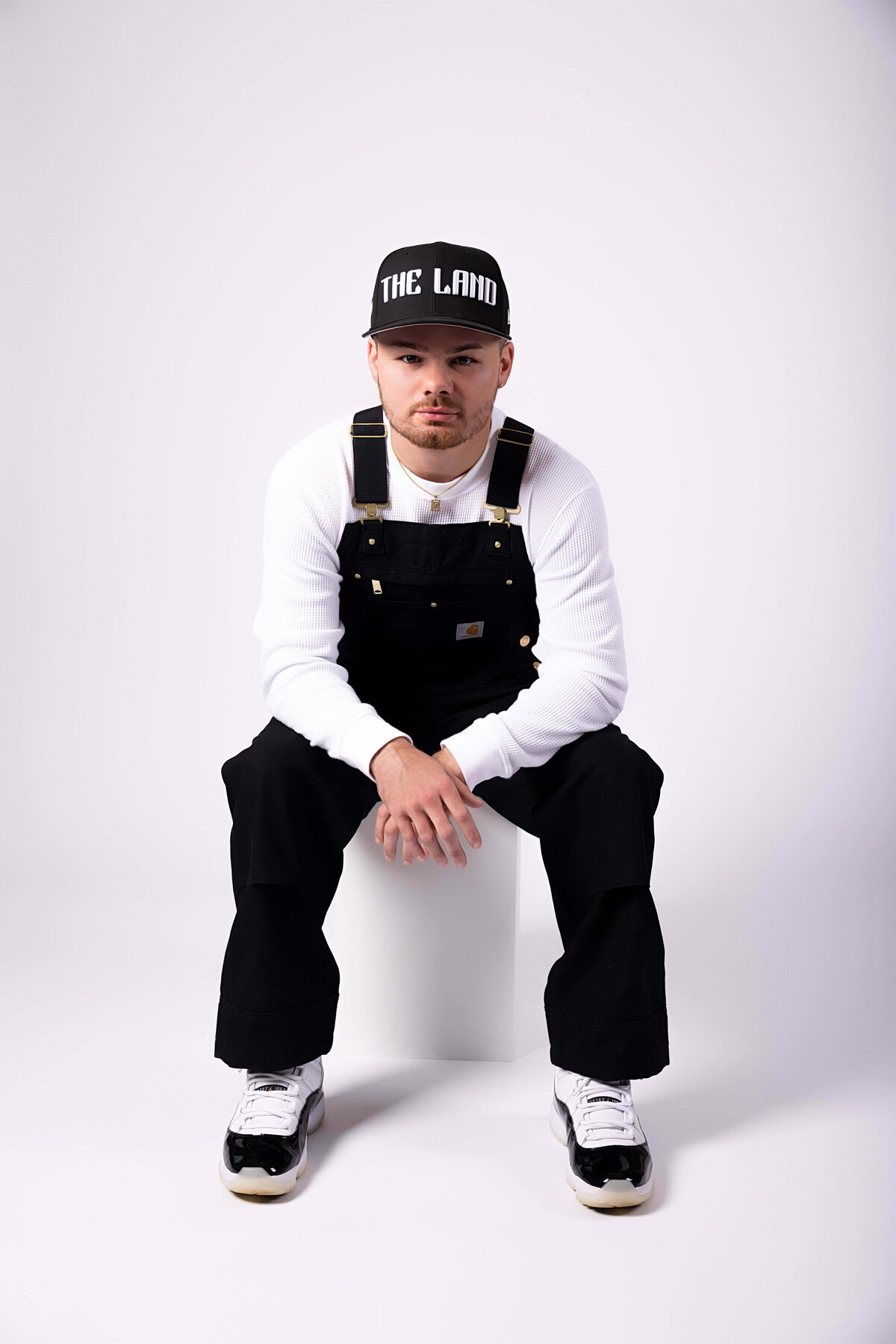 Professional boxer sitting on a box in birthday session with Reva Davis photography