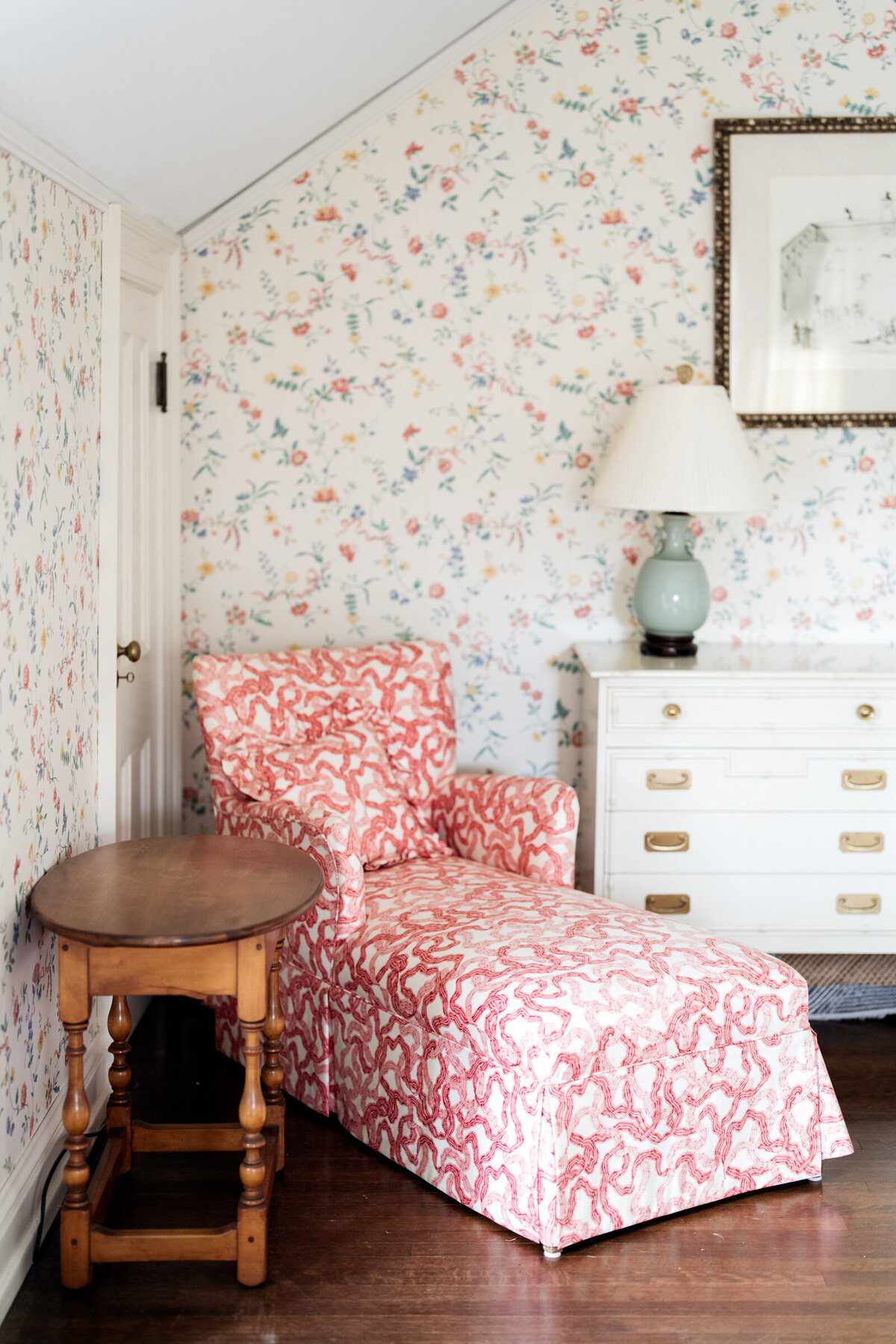 details in the bridal suite include pink chaise and floral wallpaper