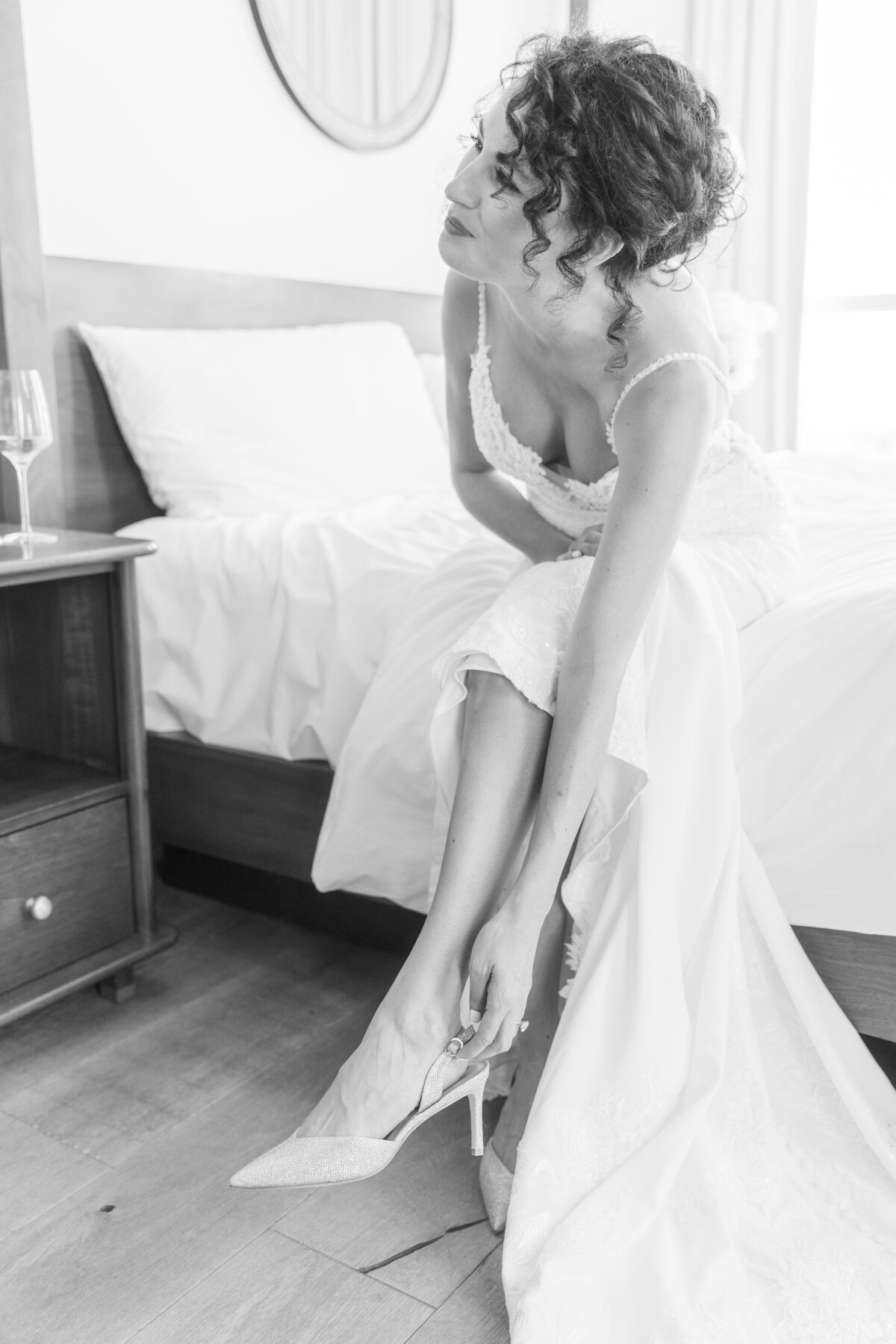 Timeless and candid black and white photo of bride getting ready at The Dewberry by South Carolina wedding photographer Sarah Beach Photography