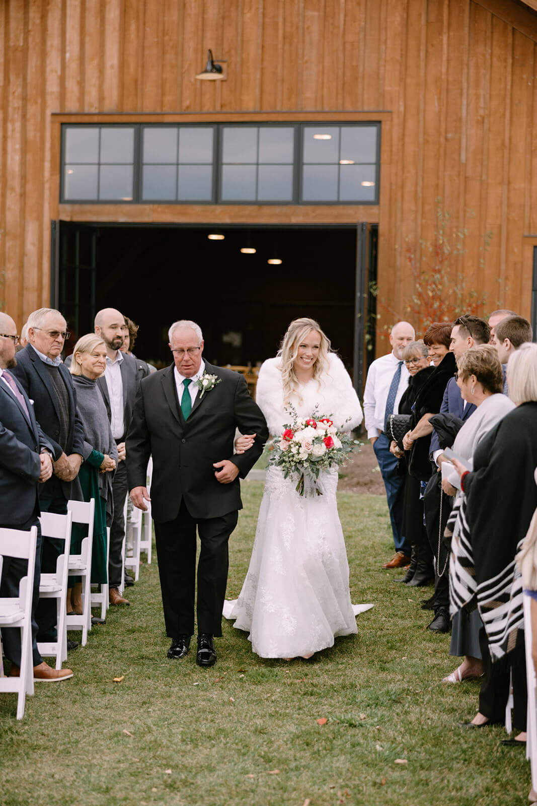 Bride walking down the aisle with father at The Lake House on Canandaigua wedding