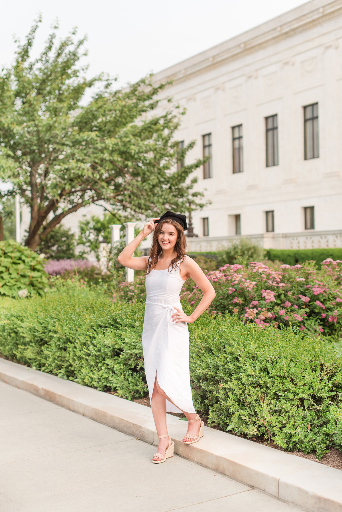 grad white  dress in marble building
