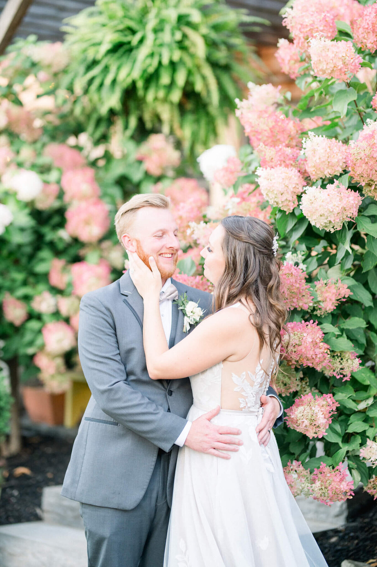 Bride and groom portrait infront of gorgeous hydrangea