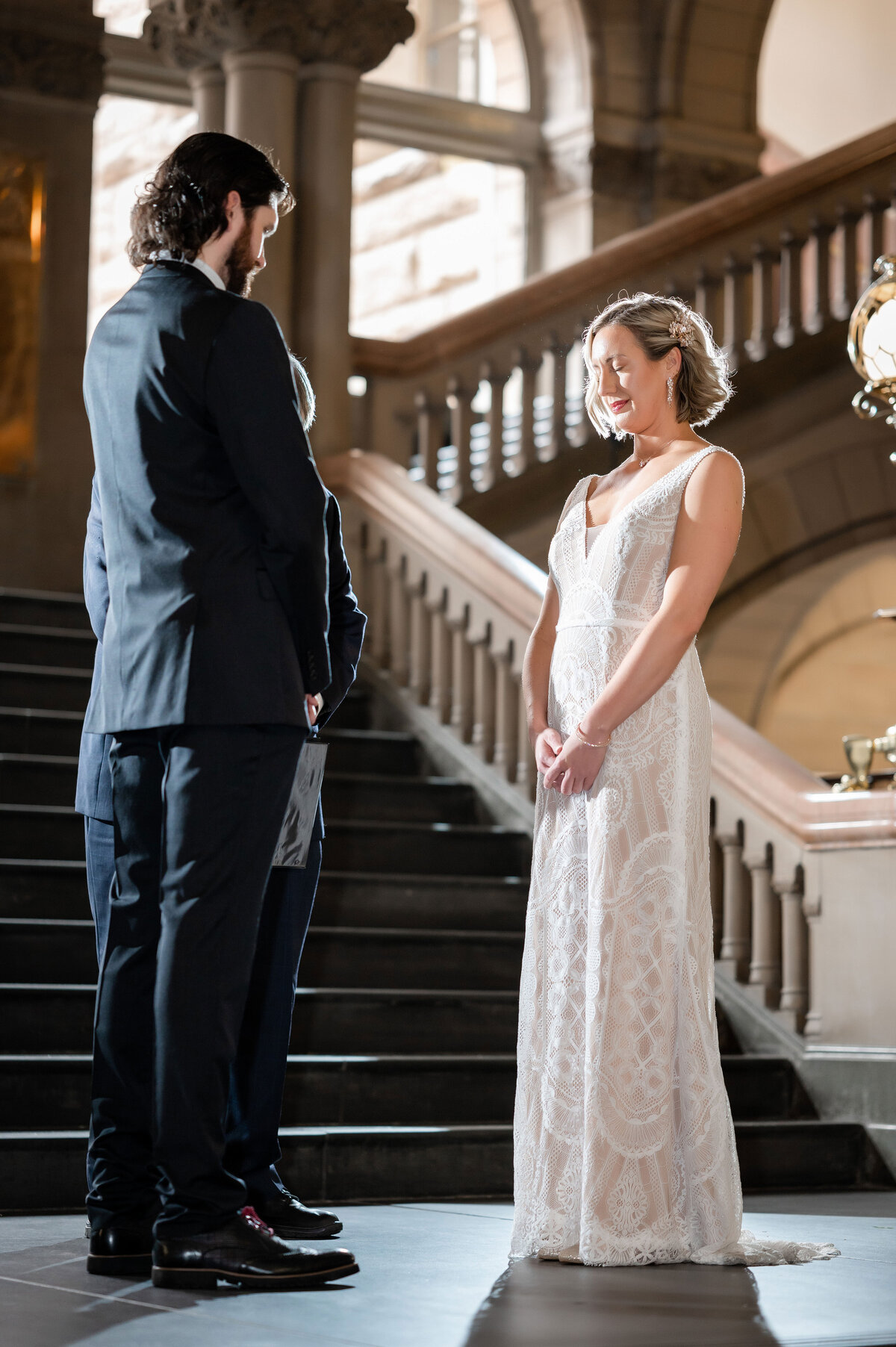 judge presiding over wedding ceremony on the grand staircase at the allegheny county courthouse