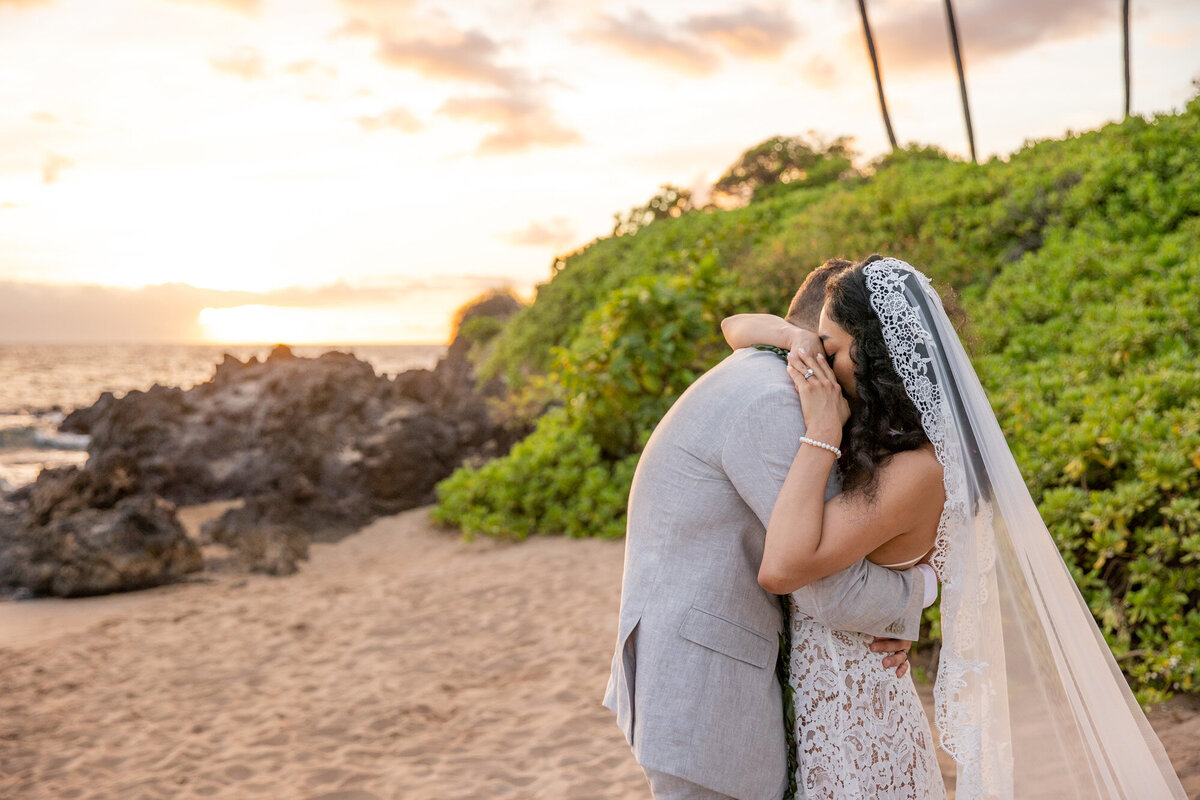 Maui Wedding Photographer captures bride and groom hugging after first look