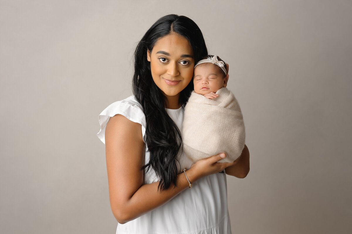 Mommy and me portrait with newborn baby in Wellington, FL portrait studio.
