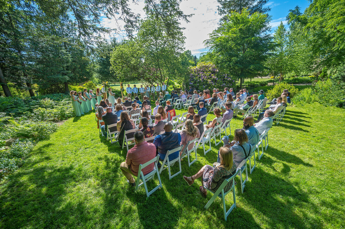 Outdoor wedding ceremony on grass at Goodell Gardens.