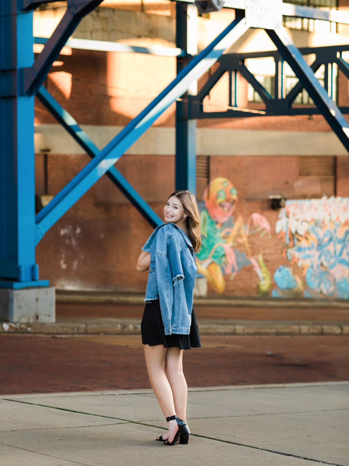 senior girl in jean jacket posed for senior portraits cleveland senior photographer