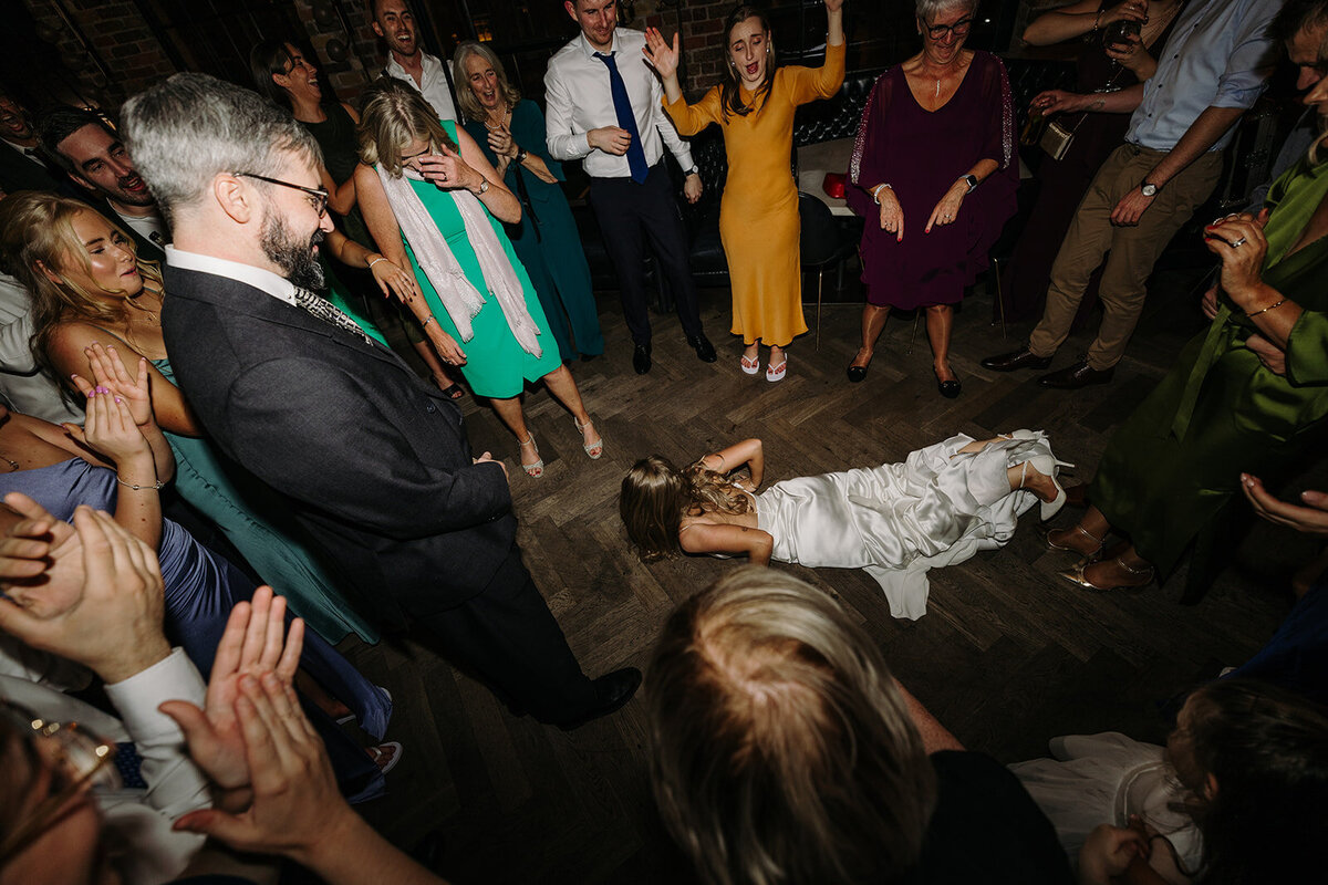 Bride doing the worm on the dance floor at Roberta's in Dublin, Ireland
