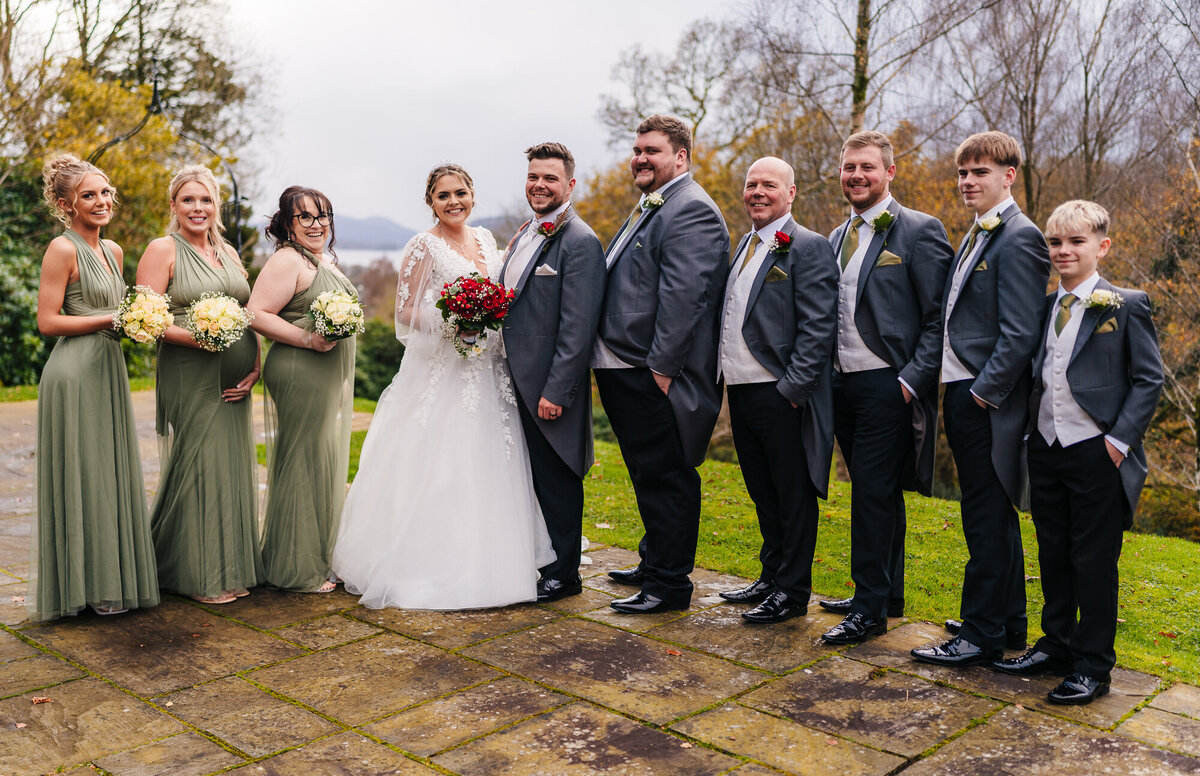 Picture of full bridal party in the lake district taken by documentary wedding photograpgher Anthony Horseman