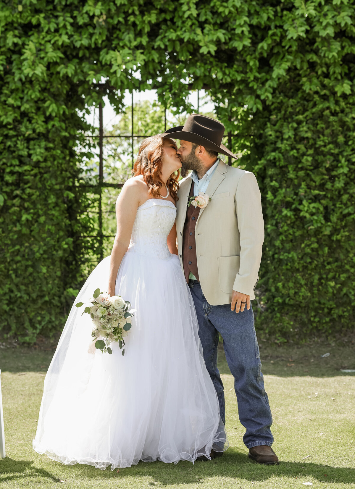 bride and groom kissing at The Bibb Mill by Columbus Georgia by Columbus Georgia wedding photographer by Columbus Georgia wedding photographer Amanda Richardson Photography
