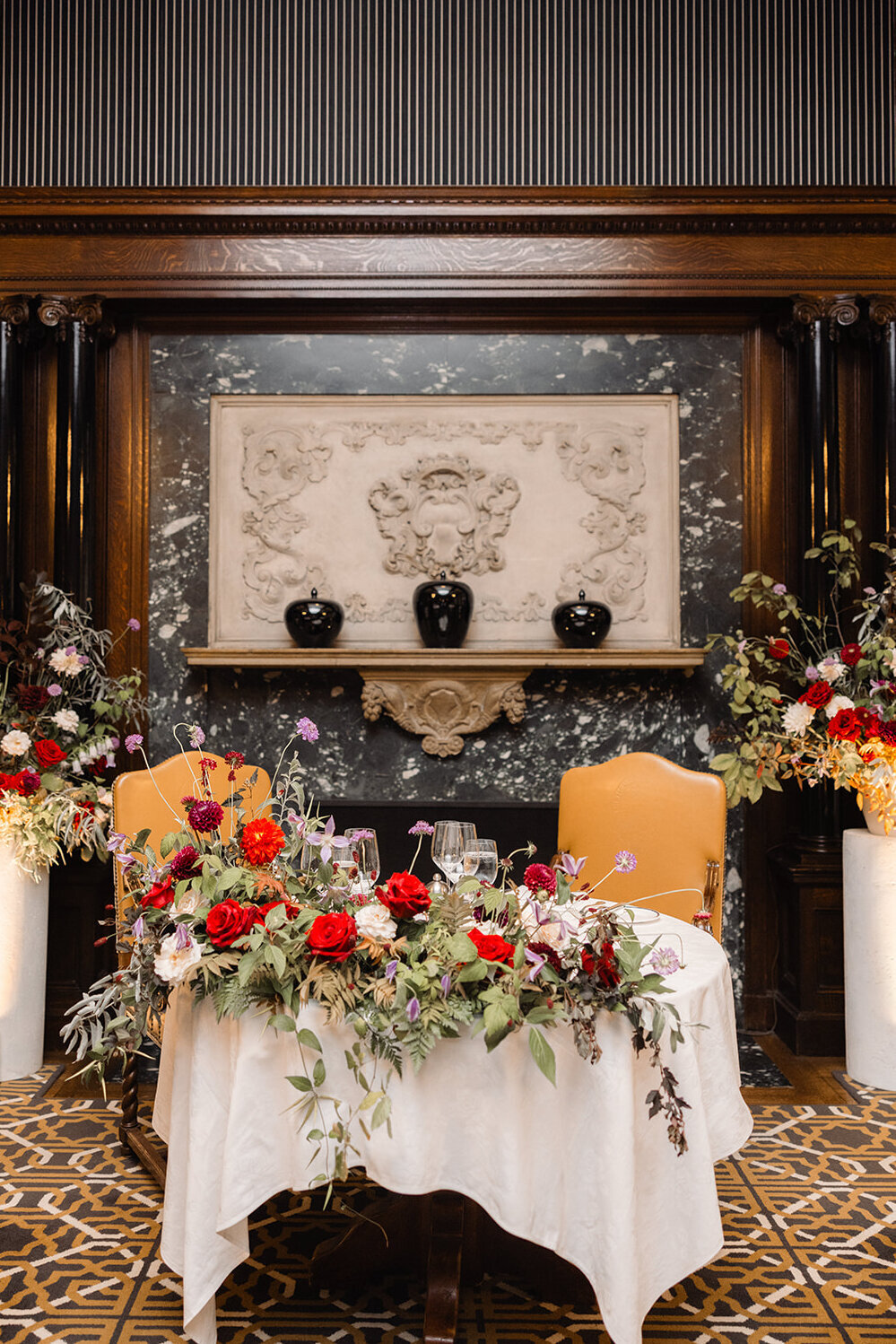 Rustic, bold sweetheart flowers and hanging greenery for a wedding reception at the Mount Royal Club.