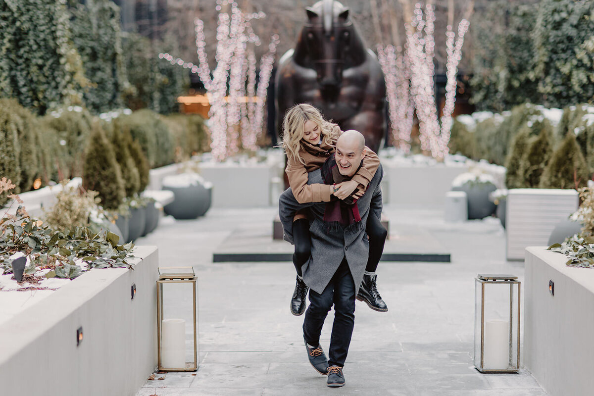 A person carrying their partner on their back 
