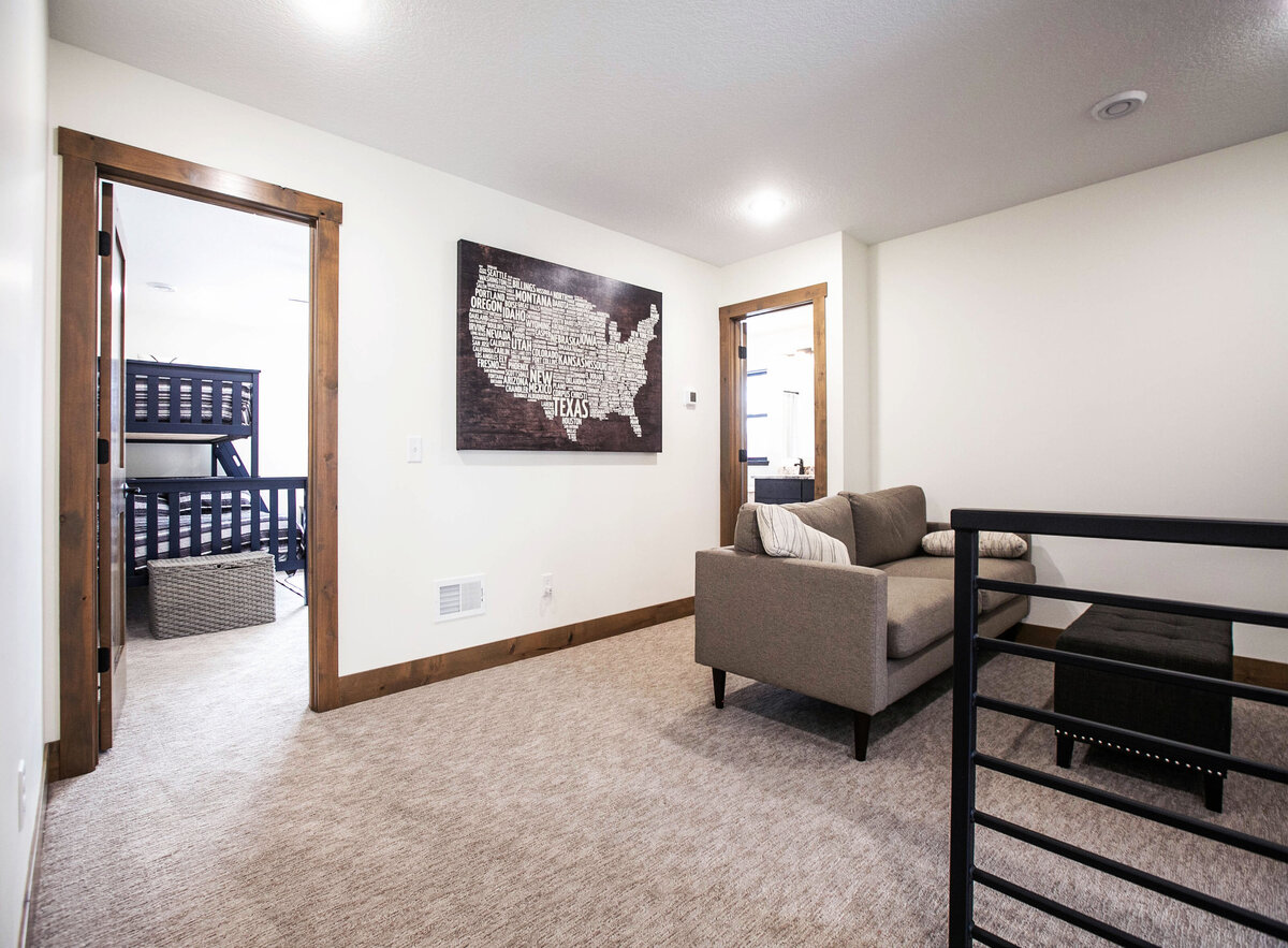Open Concept loft with neutral tones and modern accents in custom Elk RIver home