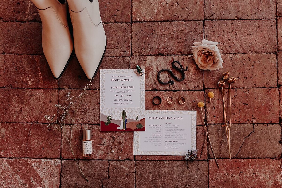 wedding photo of invitation, shoes, and her jewelry
