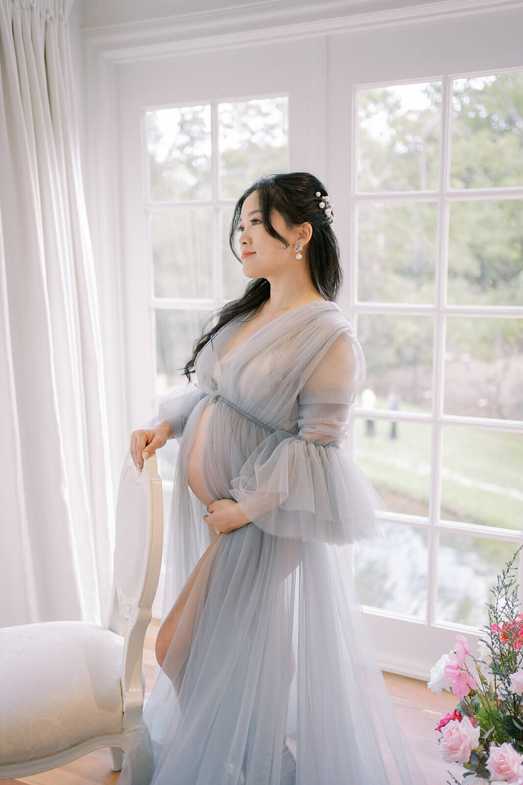 Cherish the elegance of pregnancy with a mum gracing Gold Coast's Kwila Lodge in a breathtaking blue tulle maternity shoot