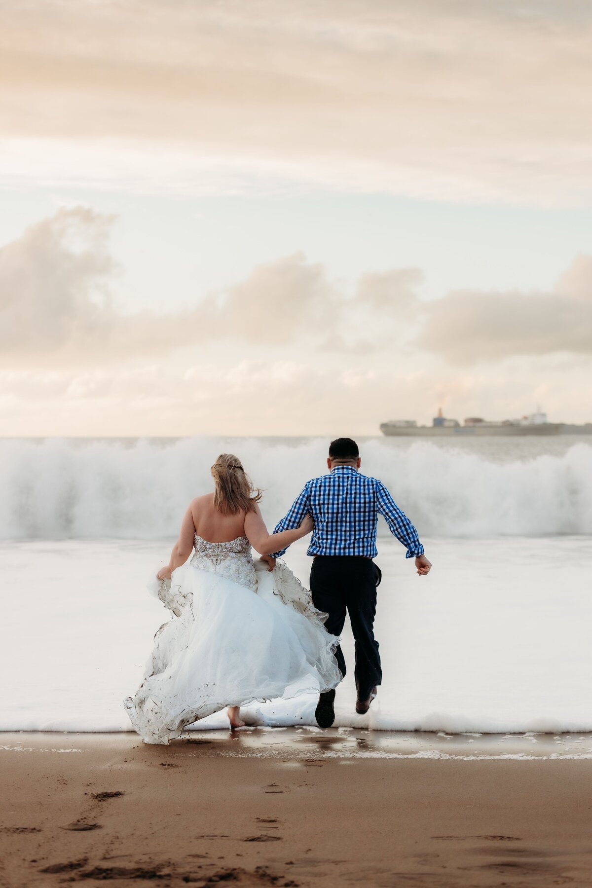 elopement-couple-running-on-baker-beach