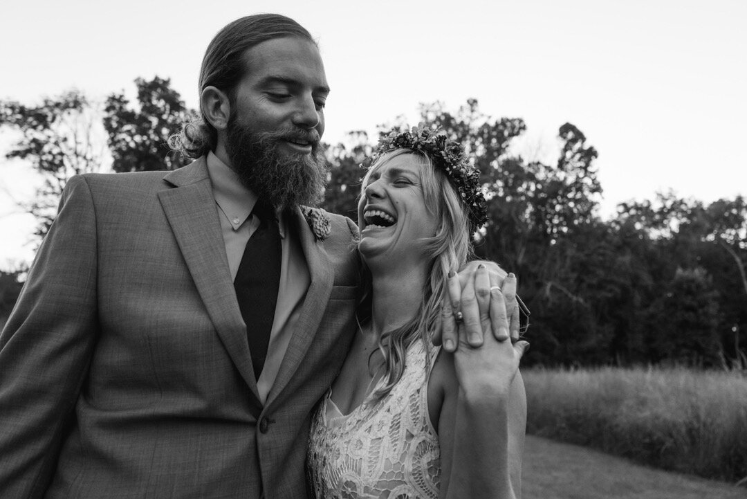 bride and groom laugh together