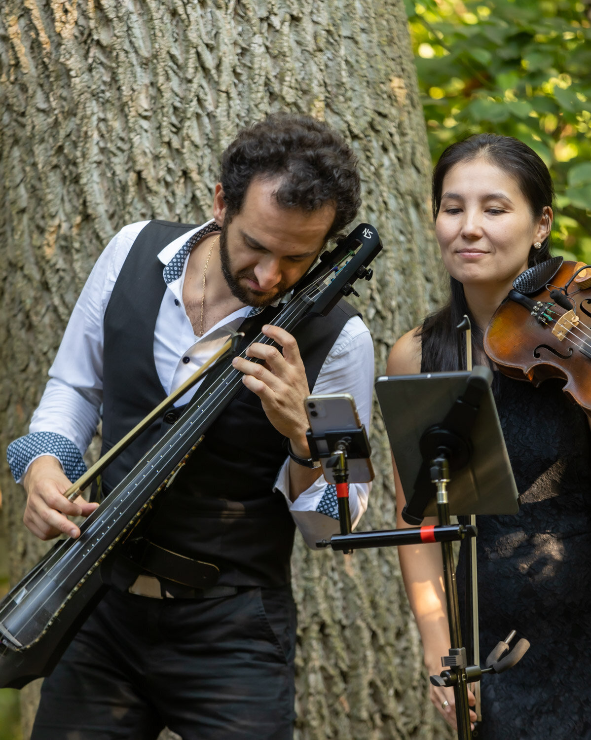 Two musicians performing outdoor events