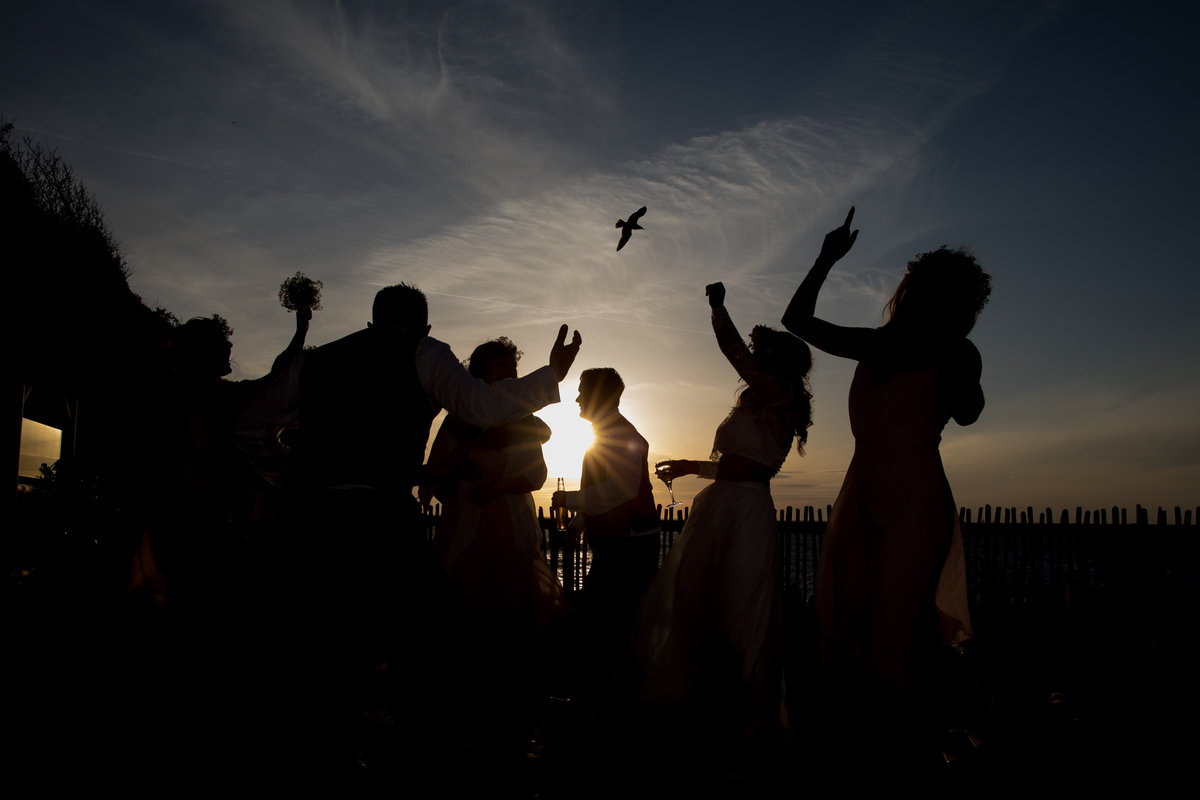 Dancing on the decking at Tunnels Beach Wedding