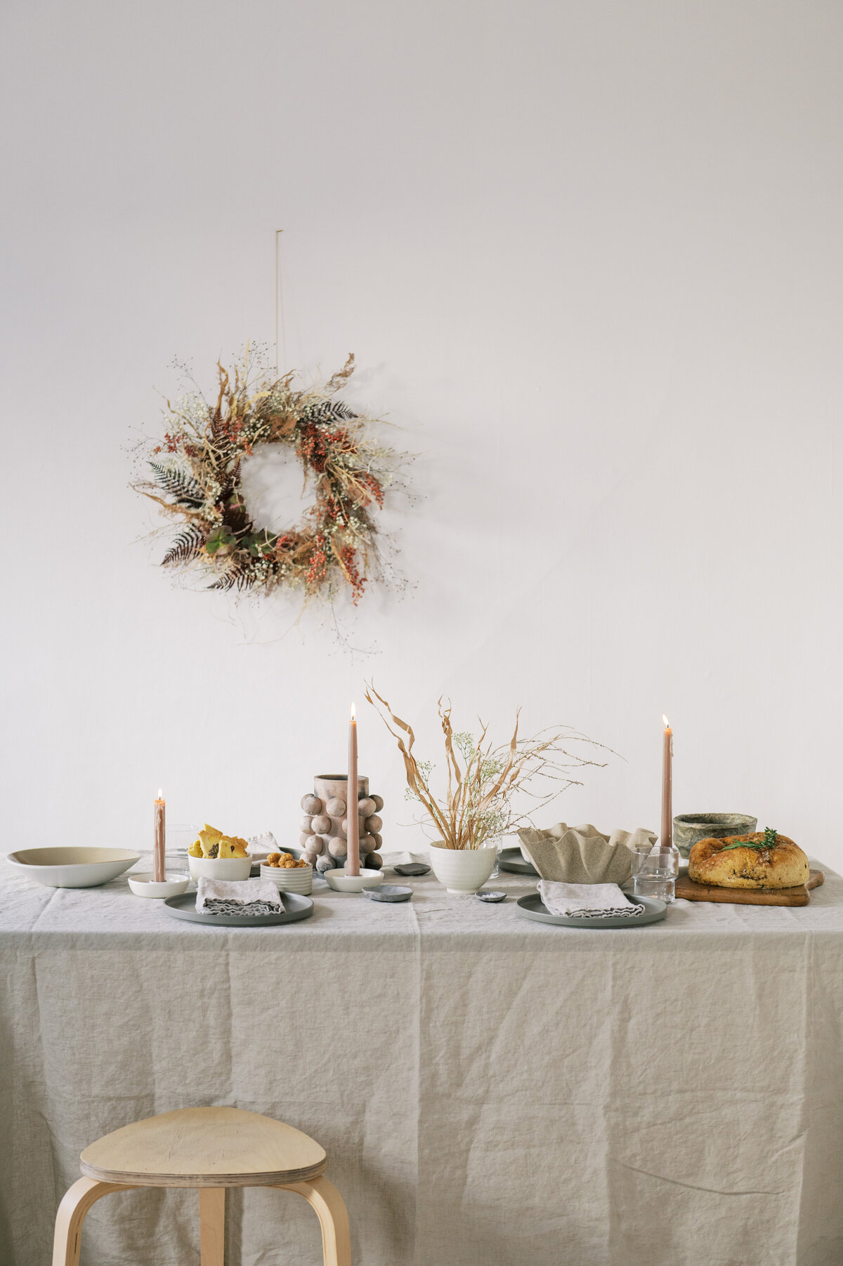 Grey Scandi tablescape with dried flowers and wreath