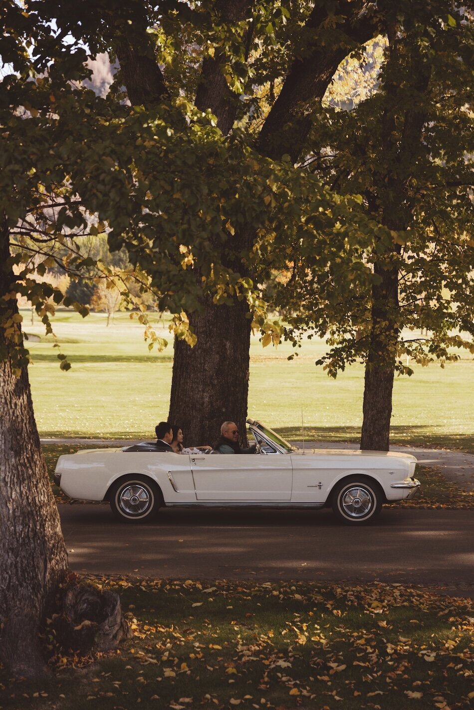 Autumn wedding shoot at Millbrook, Arrowtown. Vintage car & helicopter.