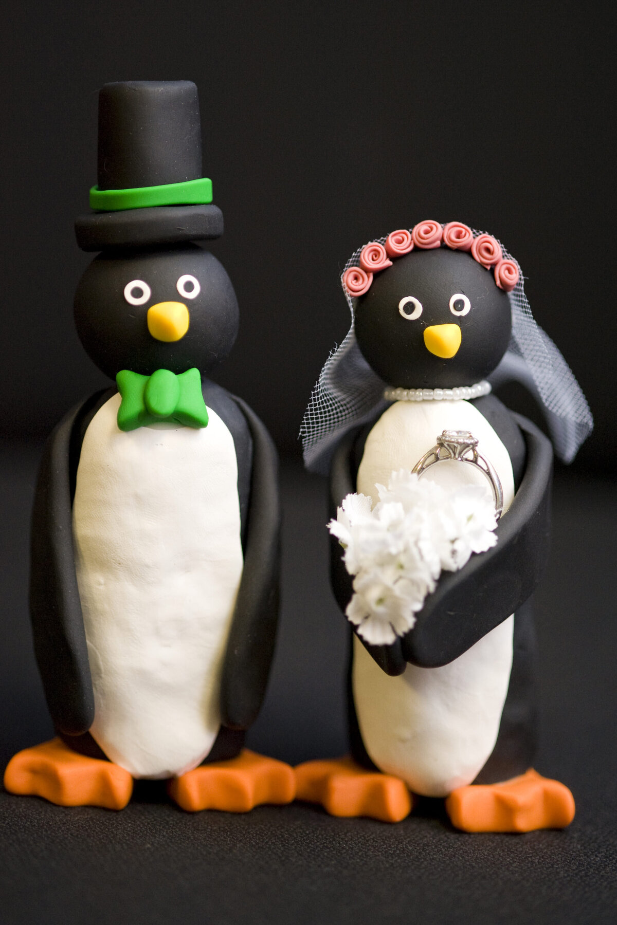 Two penguin wedding cake toppers