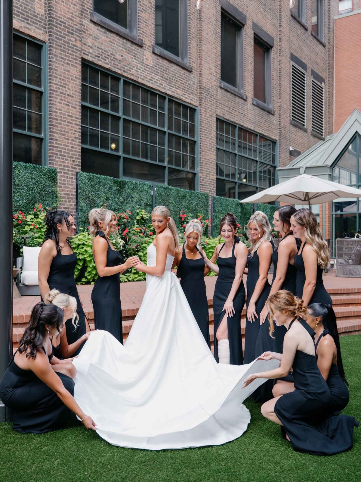 Bride surrounded by bridesmaids at The Hotel Indigo in Cleveland