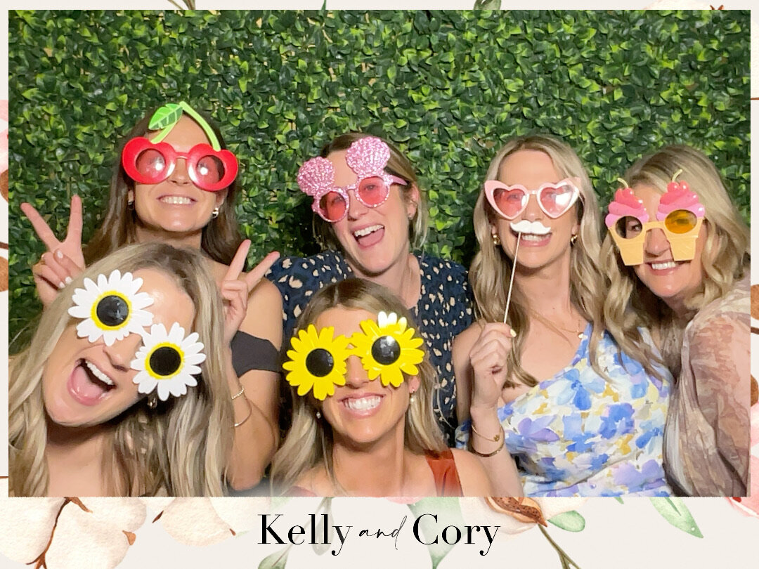 greenery backdrop for custom photo booth setup for wedding at larcomb in christchurch
