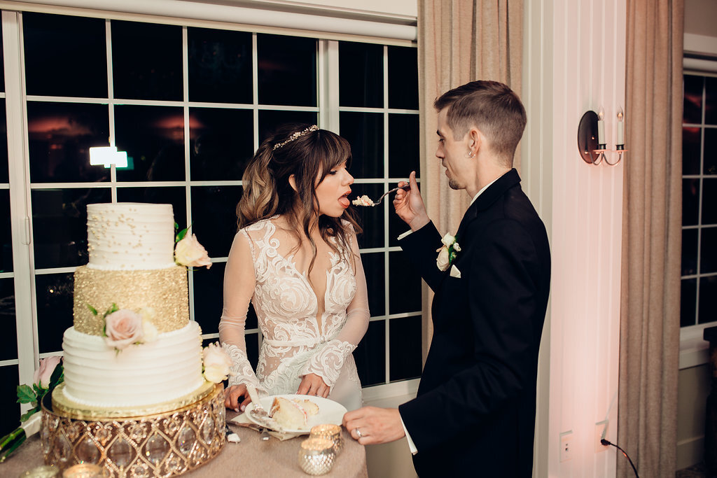 Wedding Photograph Of Groom Feeding The Bride With Cake Los Angeles