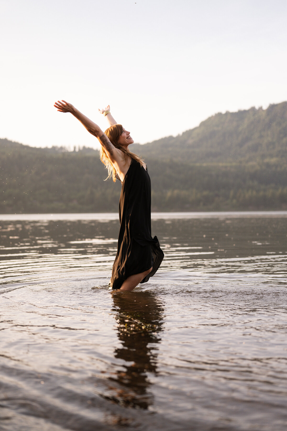 yoga teacher gazing out at the river