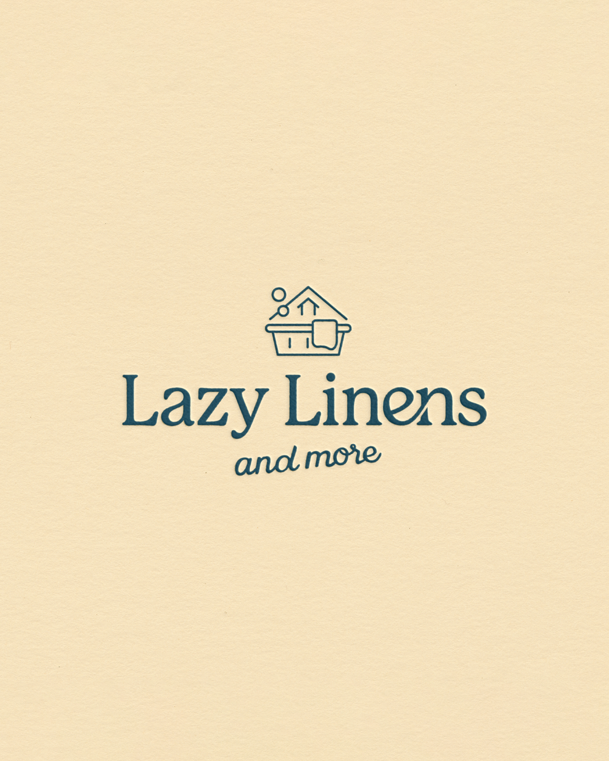 Playful yet polished logo featuring a hand-drawn laundry basket and home icon paired with a script font in deep teal on butter yellow.