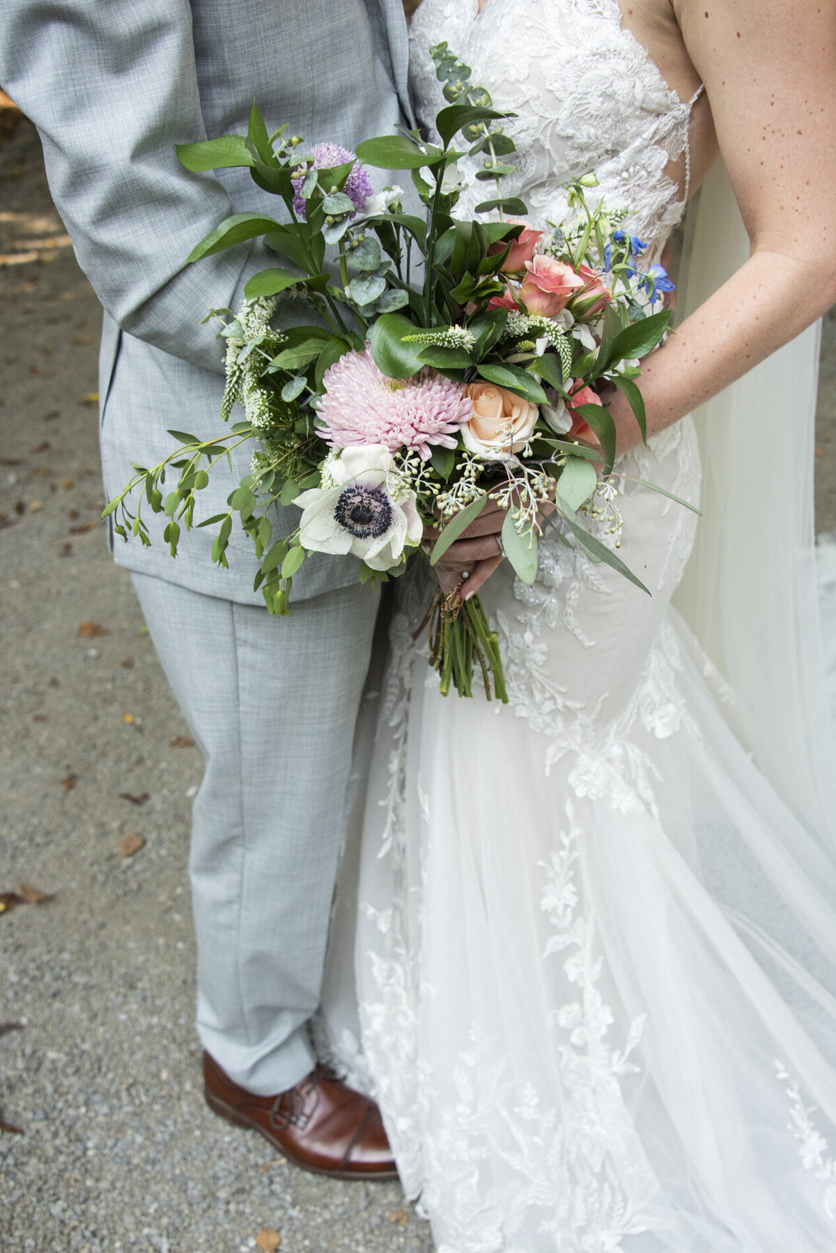 Couple holding wedding bouquet