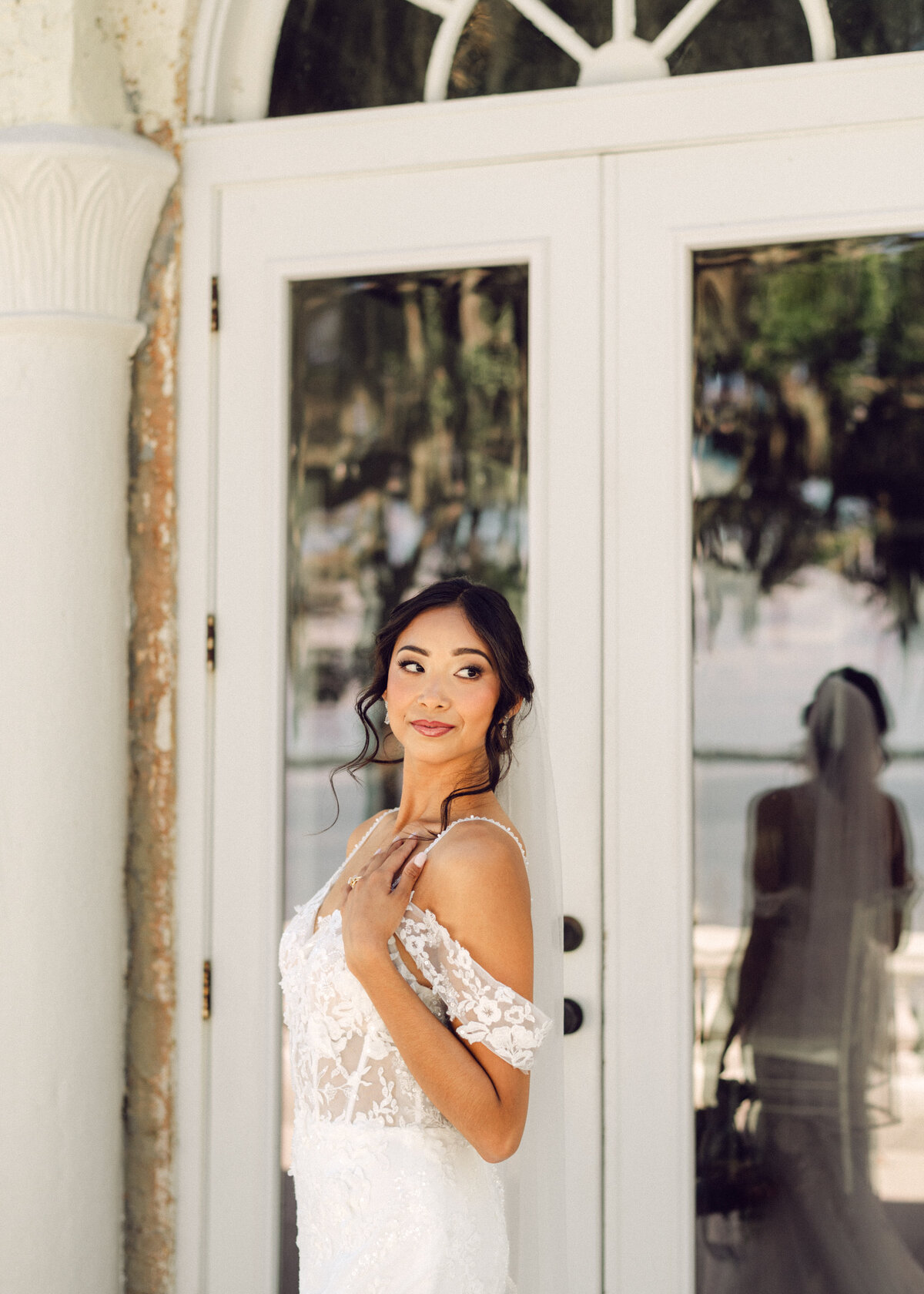 Bride lovingly looking across at groom  and reflection