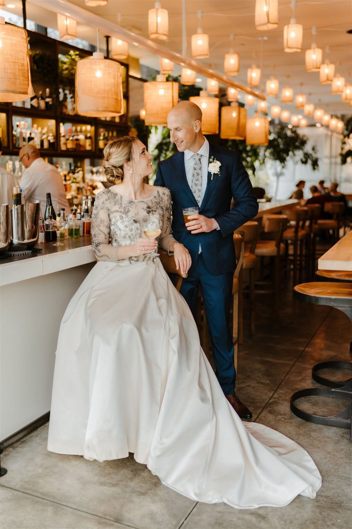 couples photos during wedding at a bar