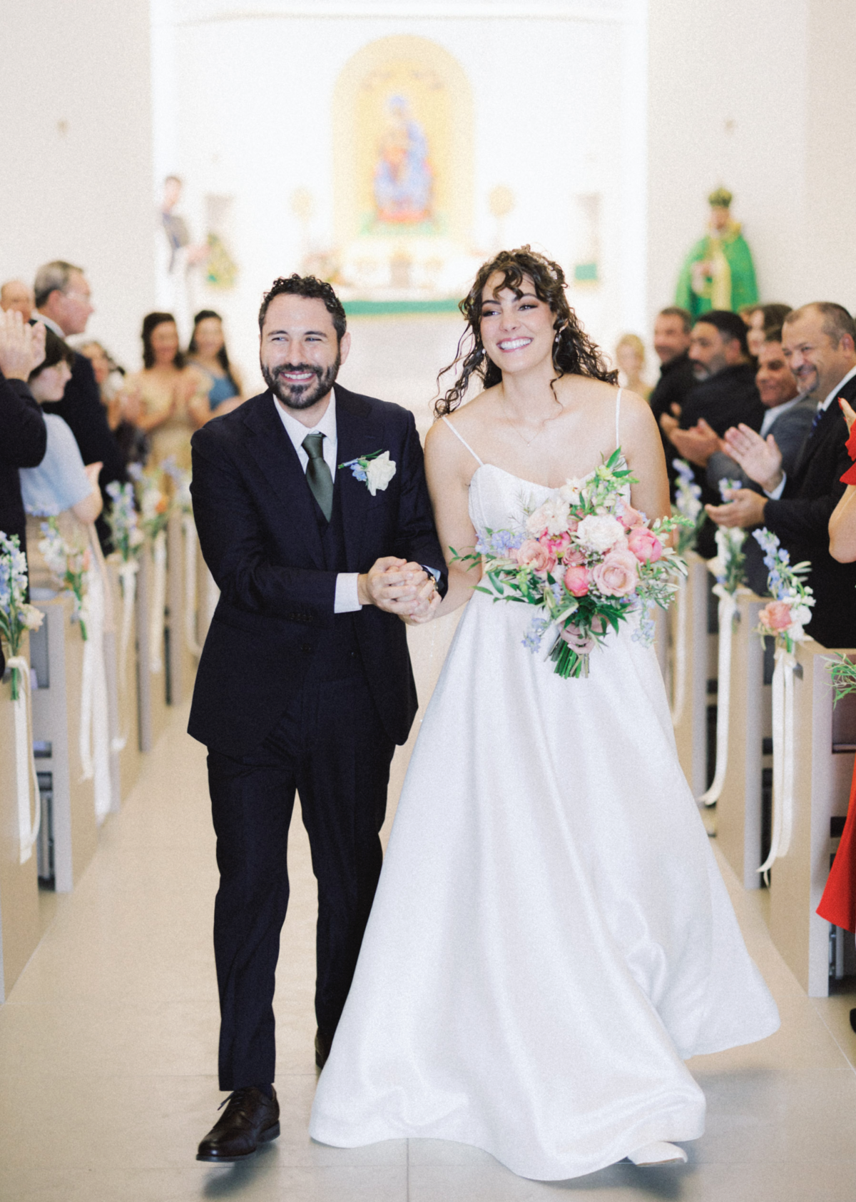 bride and groom at catholic church