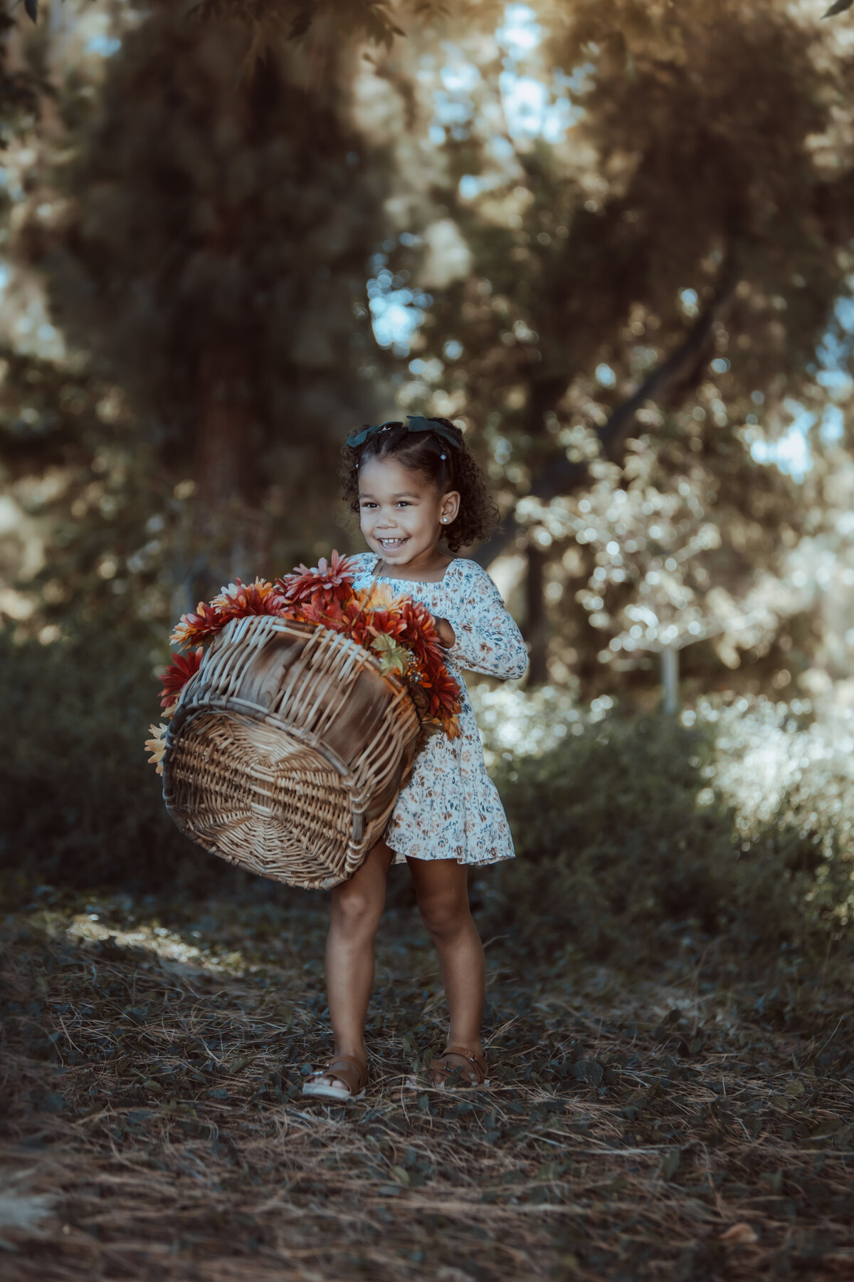 Little Girl Carrying Basket of Flowers – Prospect Park Redlands Family Photos